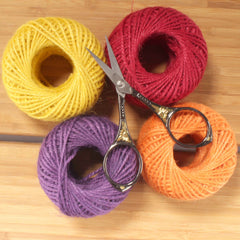Embroidery Scissors with Decorative Sun Motif Handles Spool of Thread