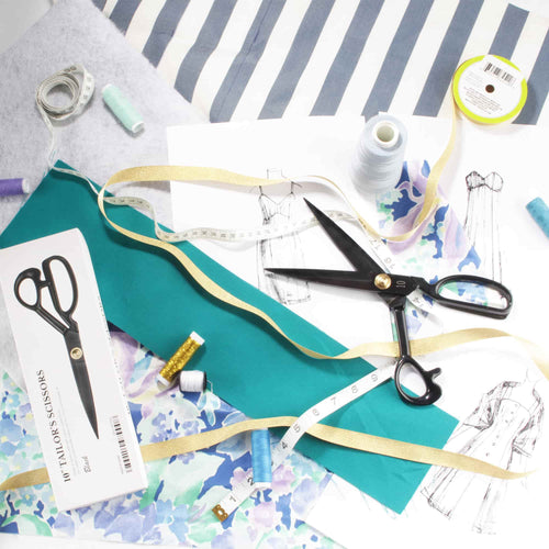 dress design with fabric scissors